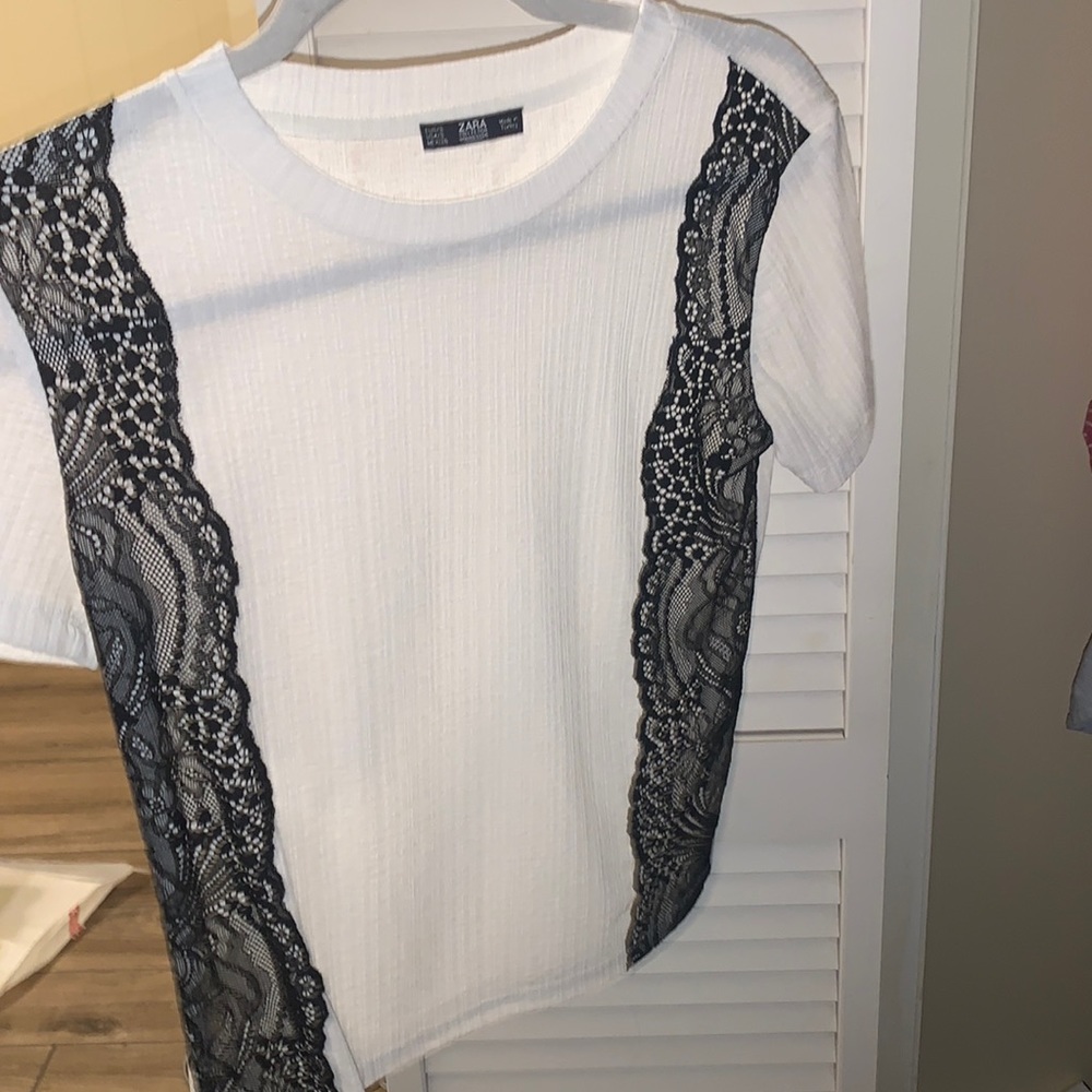 White with black design shirt